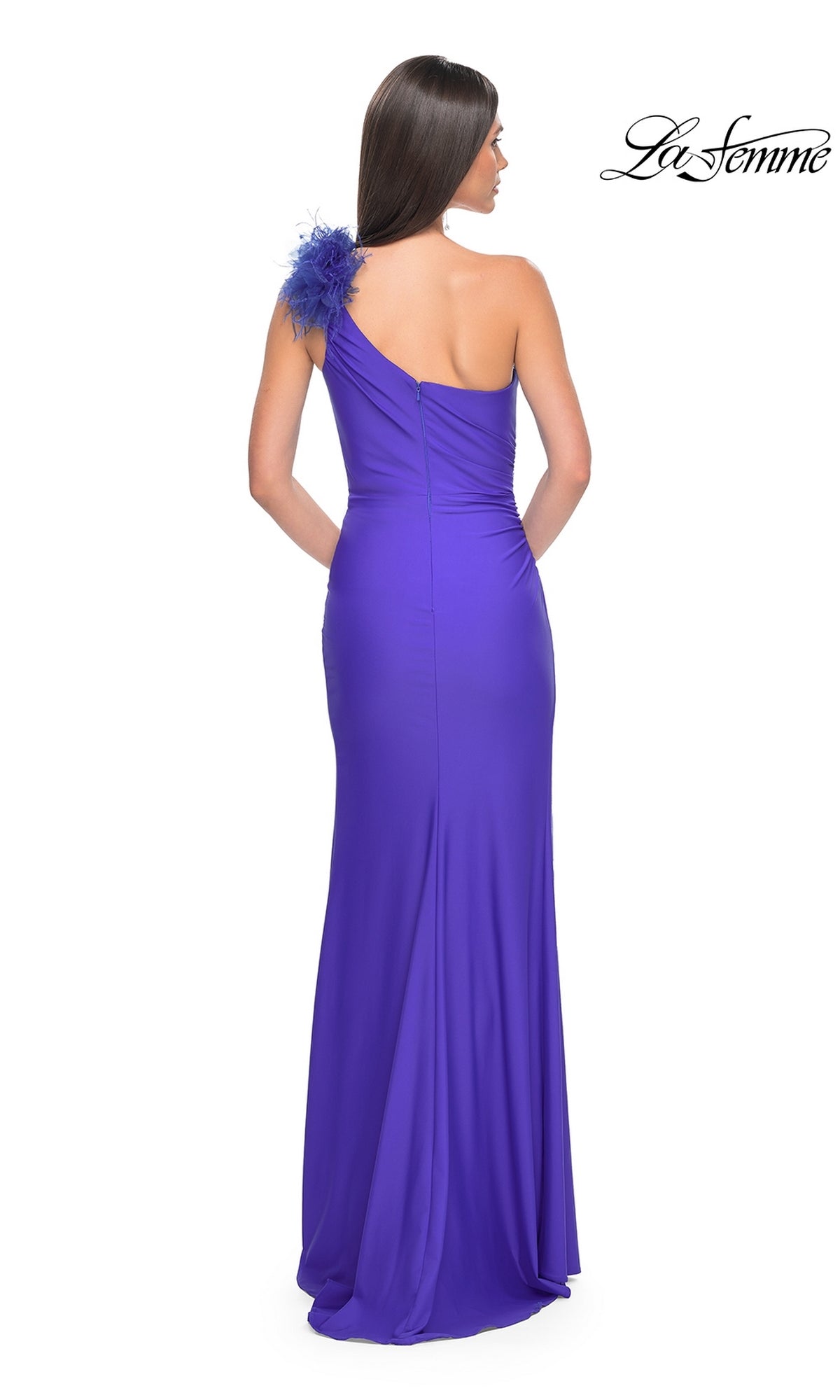 Woman in a fitted, floor-length La Femme Feathered One-Shoulder Prom Dress 32076 with feather detail on the shoulder, standing with her back to the camera.